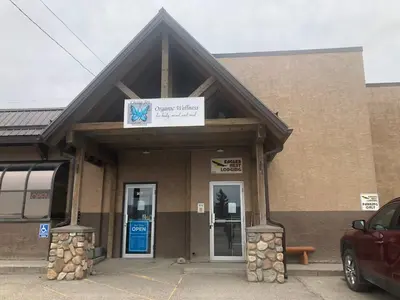 a building with a sign on the front of it at Eagles Nest Lodging in Hinton