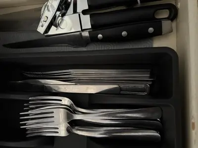 a drawer with forks and knives and other utensils at Fully furnished House near GrayNuns, Millwoods in Edmonton