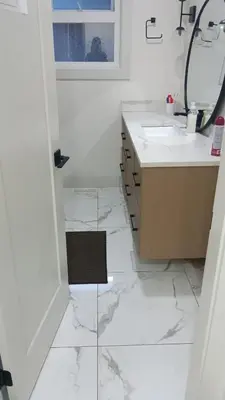 a white bathroom with a sink and a mirror at Vancouver Downtown Guest House- Walk to Skytrain & BC Place- Free Parking in Vancouver