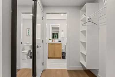 a bathroom with a toilet and a sink at King Beds Fire Place New Build in Canmore