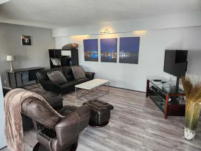 a living room with a couch and a tv at Vancouver house 3 bedrooms and balcony Perfect for your business trip to Vancouver in Vancouver