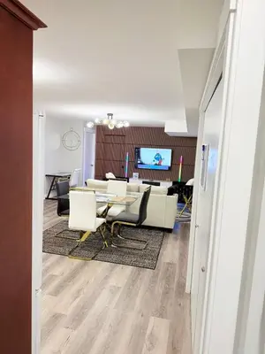 a meeting room with a table and chairs at True Haven Deluxe in Prince George