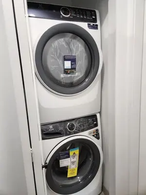 a washing machine and a dryer in a room at Vancouver Townhouse Family-Friendly with Street Parking & Balcony in Vancouver