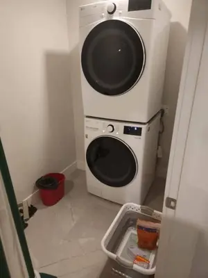 a washer and dryer in a small room at Vancouver Townhouse 2 Queen Beds Kitchen Street Parking - Perfect for Families in Vancouver