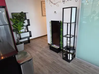 a room with a mirror and a shelf with plants at Breath-Taking-View-5 Guest DTskyline-18th Floor in Calgary