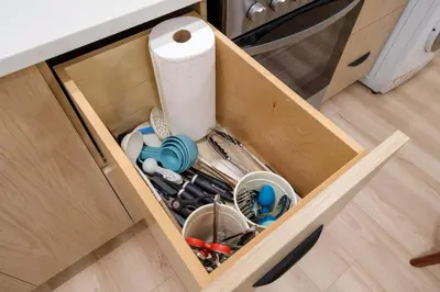 a drawer filled with kitchen utensils and a roll of paper towels at NEW Cambie Village 2 Bed Suite Near Skytrain in Vancouver