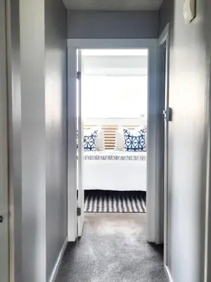 an open door to a room with a window at Modern Lake City Getaway in Penticton