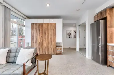 a living room with a couch and a table at Modern Downtown Studio Bedroom Walk Everywhere in Vancouver