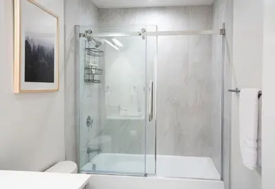 a bathroom with a shower with a glass door at Qs Hideaway in Mackenzie Village in Revelstoke