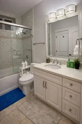 a bathroom with a sink and a toilet and a mirror at Luxury New 2BR Private Suite In Vancouver West Full Kitchen in Vancouver