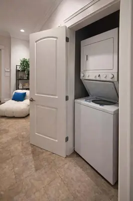 a kitchen with a washer and dryer in a room at Luxury New 2BR Private Suite In Vancouver West Full Kitchen in Vancouver