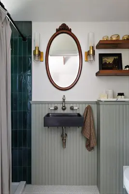 a bathroom with a sink and a mirror at The Garden Studio in Victoria