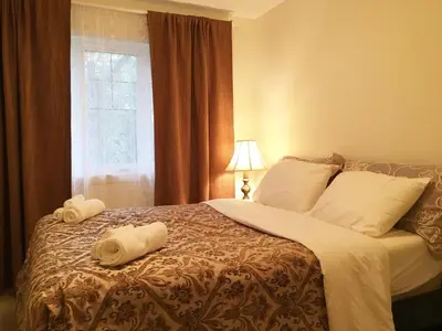 a bedroom with a bed with towels on it at Modern Vacation Home Near West Edmonton Mall, Transit Center & LRT - 3BR in Edmonton