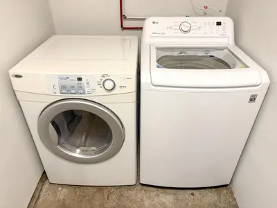 a washing machine and a washer in a room at Vancouver UBC 2BD Suite in Vancouver
