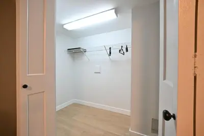 an empty room with a door and a light at Vancouver UBC 2BD Suite in Vancouver