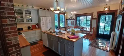 a large kitchen with a island in the middle at Rosewood in New Westminster