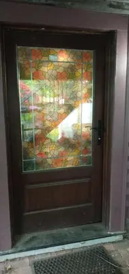 a door with a dog sticking its head inside at Rosewood Garden Studio in New Westminster