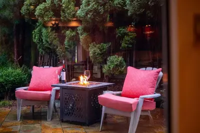 two chairs and a table with a candle on it at Entire Spanish Style Villa 5 Bedrooms near Ocean in West Vancouver