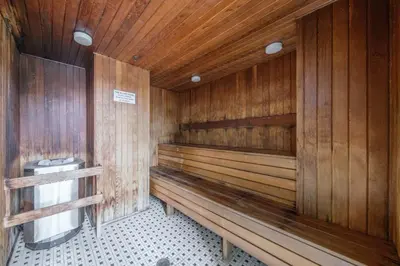 a wooden sauna with a toilet in it at Cozy Condo in Prime Location with Jacuzzi Pool & Sauna in Vancouver