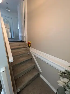 a stairwell in a home with a wooden staircase at The Love Home Stay in Edmonton