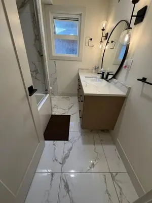 a white bathroom with a sink and a mirror at Downtown Vancouver Rooms - Walk to SkyTrain & BC Place, Free Parking & Fast Wi-Fi in Vancouver