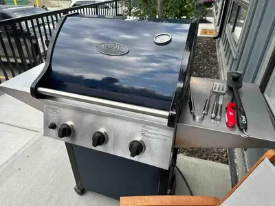 a grill sitting on top of a table at Pet-friendly Walk-Up Condo with Pool & Hot tub! in Canmore