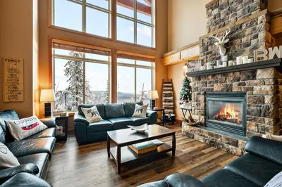 a living room with couches and a fireplace at Blackrock 6 in Big White