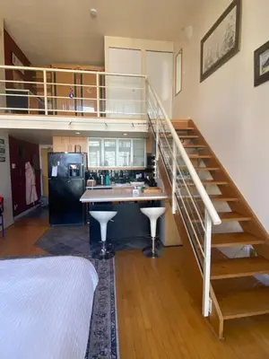 a kitchen with a spiral staircase in a house at 933 seymour at vancouver downtown in Vancouver