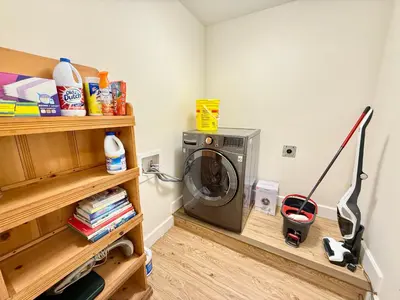a laundry room with a washing machine in it at Private Guest Suite, Two Parking Spaces in Maple Ridge District Municipality