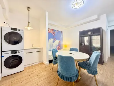 a kitchen and dining room with a table and chairs at Private Guest Suite, One Parking Space in Maple Ridge District Municipality