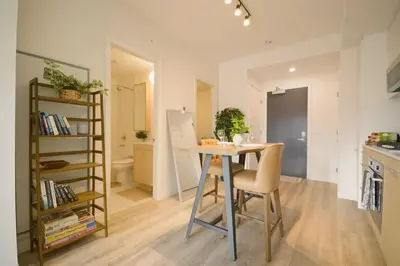a kitchen with a table and chairs in a room at 1506 First and Park in Calgary