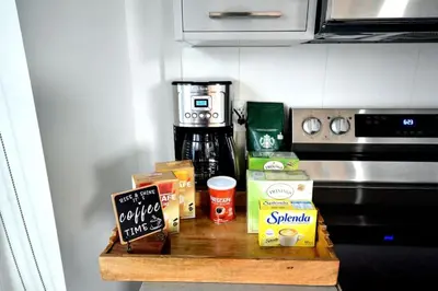 a counter with some food on top of a stove at Cozy Downtown Retreat with Stunning River Views in Calgary