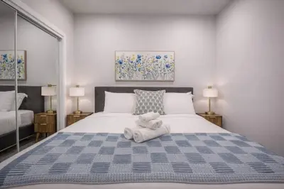 a bedroom with a bed with a stuffed animal on it at 418 Frontier in Calgary