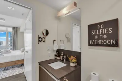 a bathroom with a sink and a no stairs in the bathroom at 1409 Guardian South in Calgary