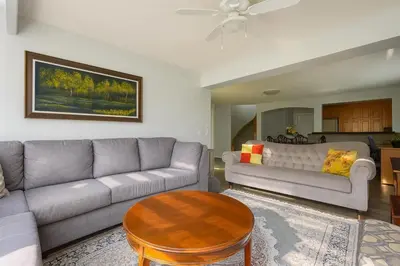 a living room with a couch and a table at Shiraz Place in Calgary