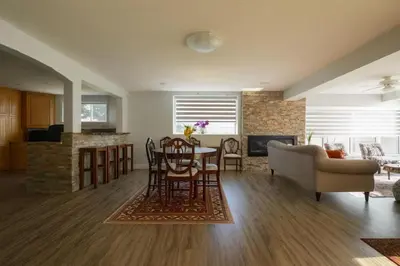 a living room with a table and a couch at Shiraz Place in Calgary