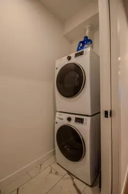 a washer and dryer in a corner of a room at 431 Frontier in Calgary