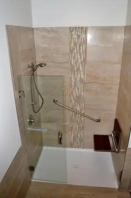a shower with a glass door in a bathroom at Radium Elk Park B & B in Radium Hot Springs