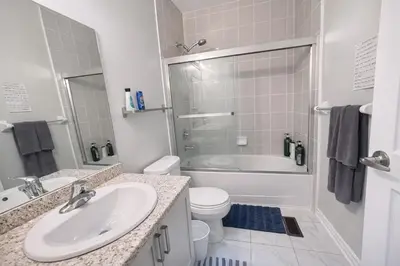 a bathroom with a sink and a toilet and a shower at Quiet Private Master Suite w Ensuite Great Value in Bélanger
