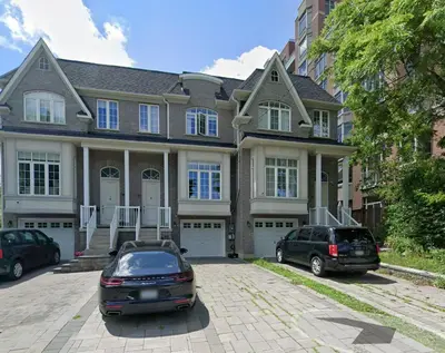 a house with two cars parked in front of it at Quiet Private Master Suite w Ensuite Great Value in Bélanger