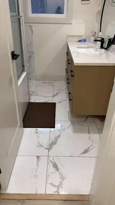 a white bathroom with a sink and a mirror at Vancouver Downtown Apartment - Walk to SkyTrain & BC Place, Free Parking in Vancouver