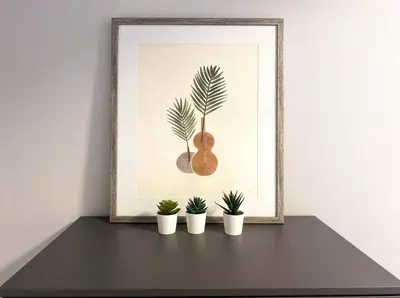 a picture of a guitar and four potted plants on a shelf at Modern 2BR Suite with Private Yard in Calgary