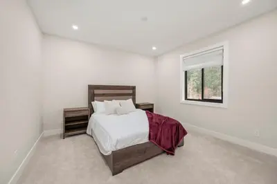 a white bedroom with a bed and a window at Luxury 5BR Modern Home Huge Open Layout in Langley