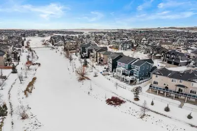 an aerial view of a city in the snow at 1BR Entertainment Space Projector and Games Room in Airdrie