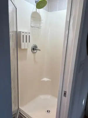 a shower with a glass door with a shower at private 1br guest suite Vancouver in Vancouver