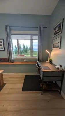 a living room with a desk and a window at 'The Lookout' Sea View Suite w Hot tub in Shirley