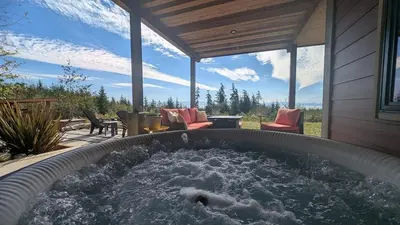a hot tub in the middle of a patio at 'The Lookout' Sea View Suite w Hot tub in Shirley