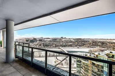 a balcony with a view of a city at Dt Spacious and Vibrant | Kng Bed| Outdoor patio in Calgary