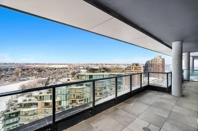a balcony with a view of a city at Dt Spacious and Vibrant | Kng Bed| Outdoor patio in Calgary