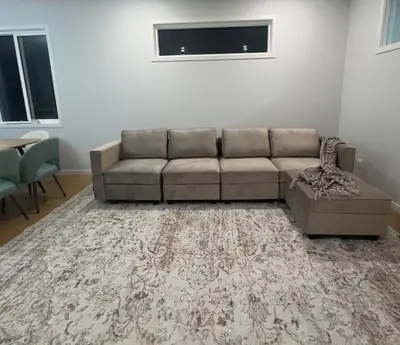 a living room with a couch and a table at Cozy 1bedroom Mainfloor in Calgary